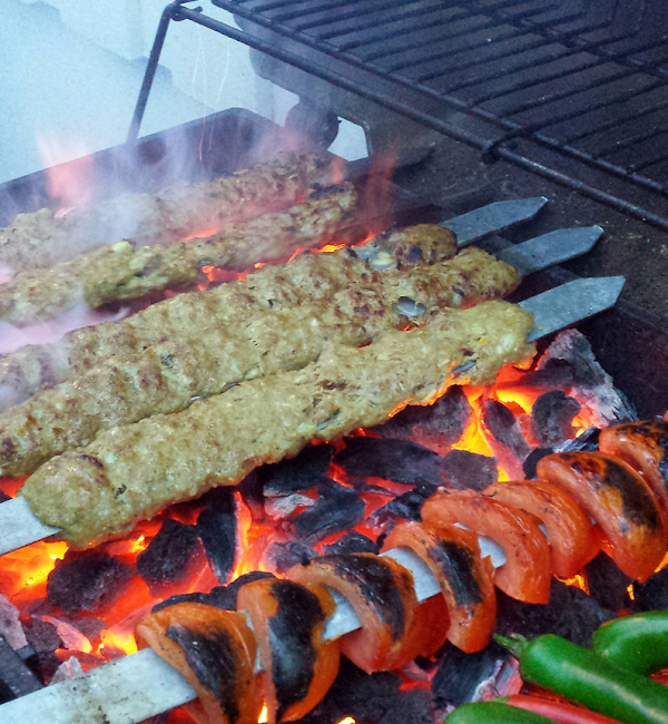 Kabobs over glowing charcoal
